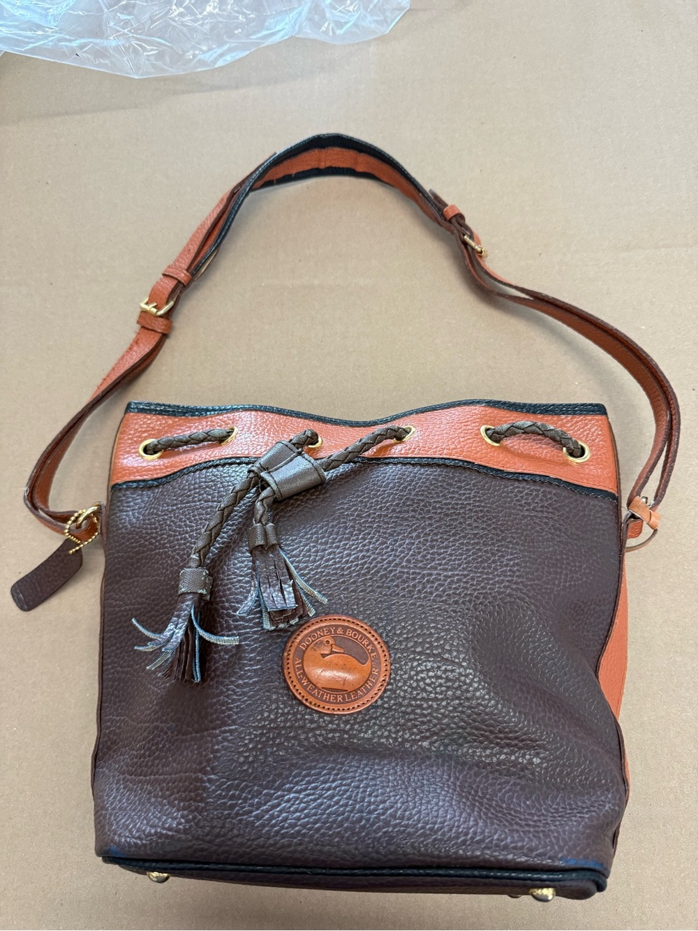 Dooney & Bourke Brown and Orange Leather Drawstring Bucket Shoulder Bag